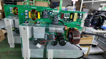 ARCPEX MIG200 actual PCB board showing 4-stage EMI filter: common-mode inductor, X-capacitors and Y-capacitors